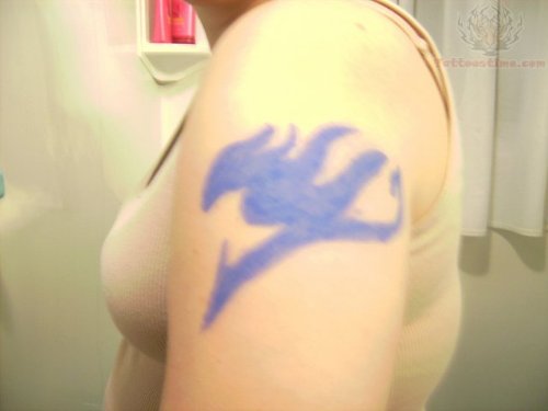 Purple Ink Fairy Tail Tattoo On Shoulder